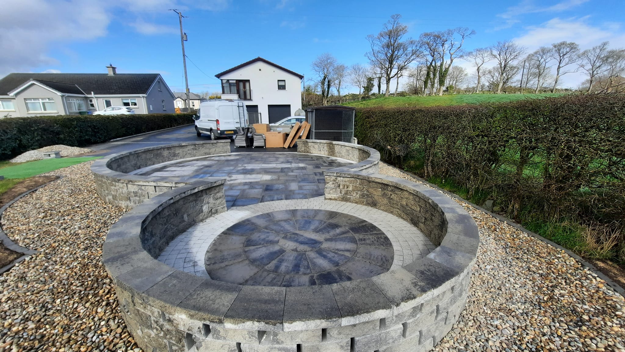 Circular shaped patio with low rise wall