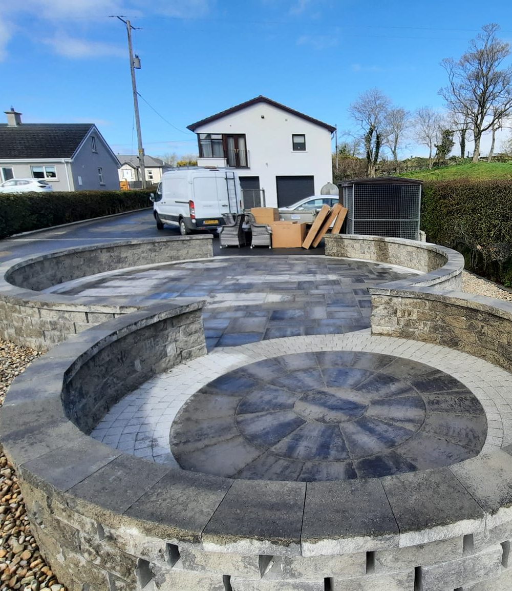 Circular shaped patio with low rise wall