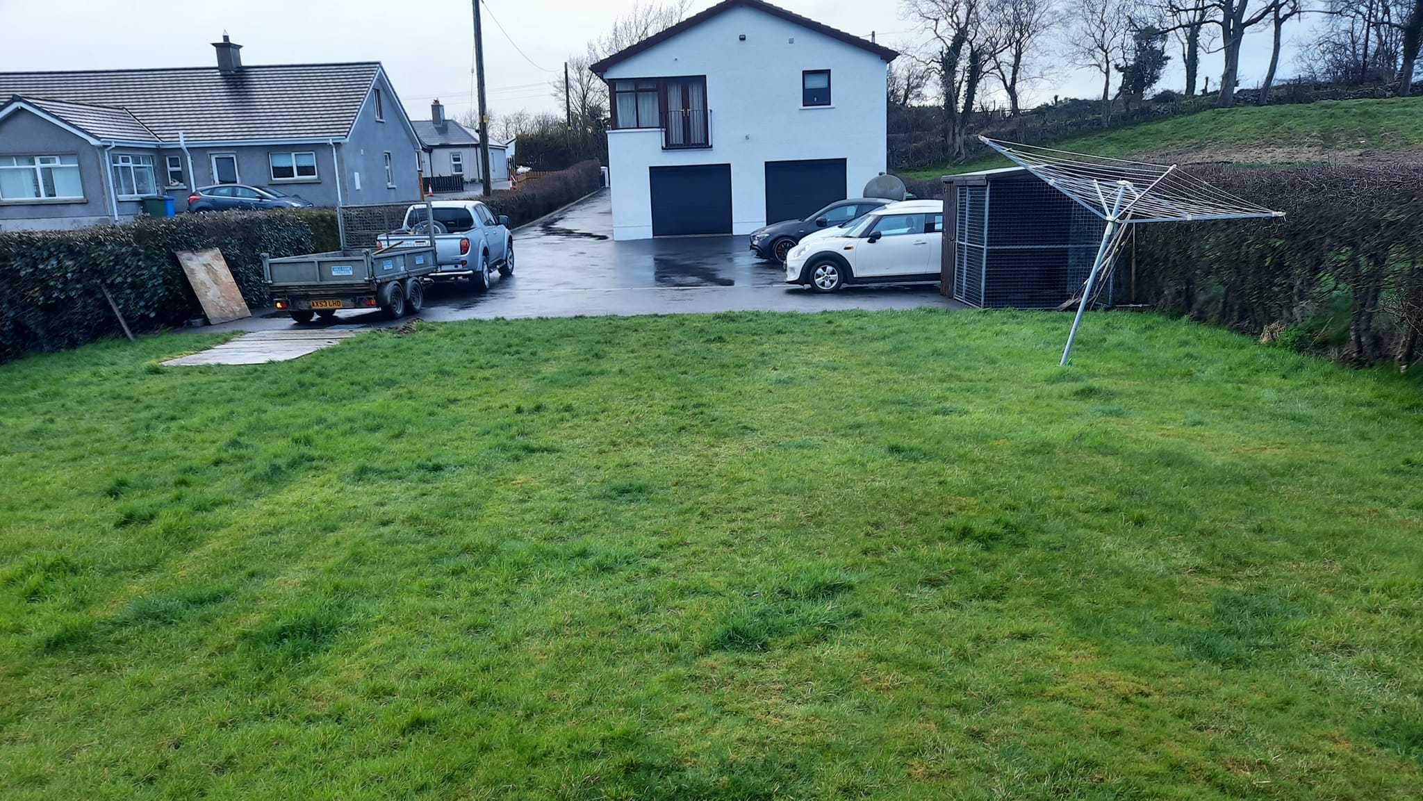 Grass garden before installation of a new patio, view of the house