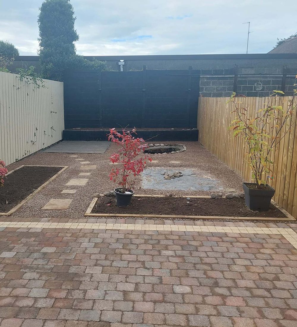 Garden revamp with paving stones and a pond