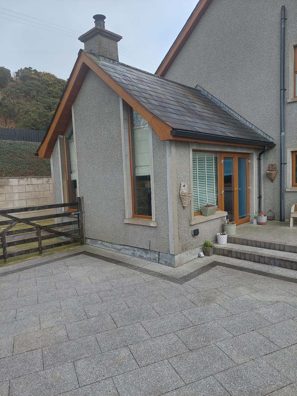 Newly built extension to a house with long vertical windows